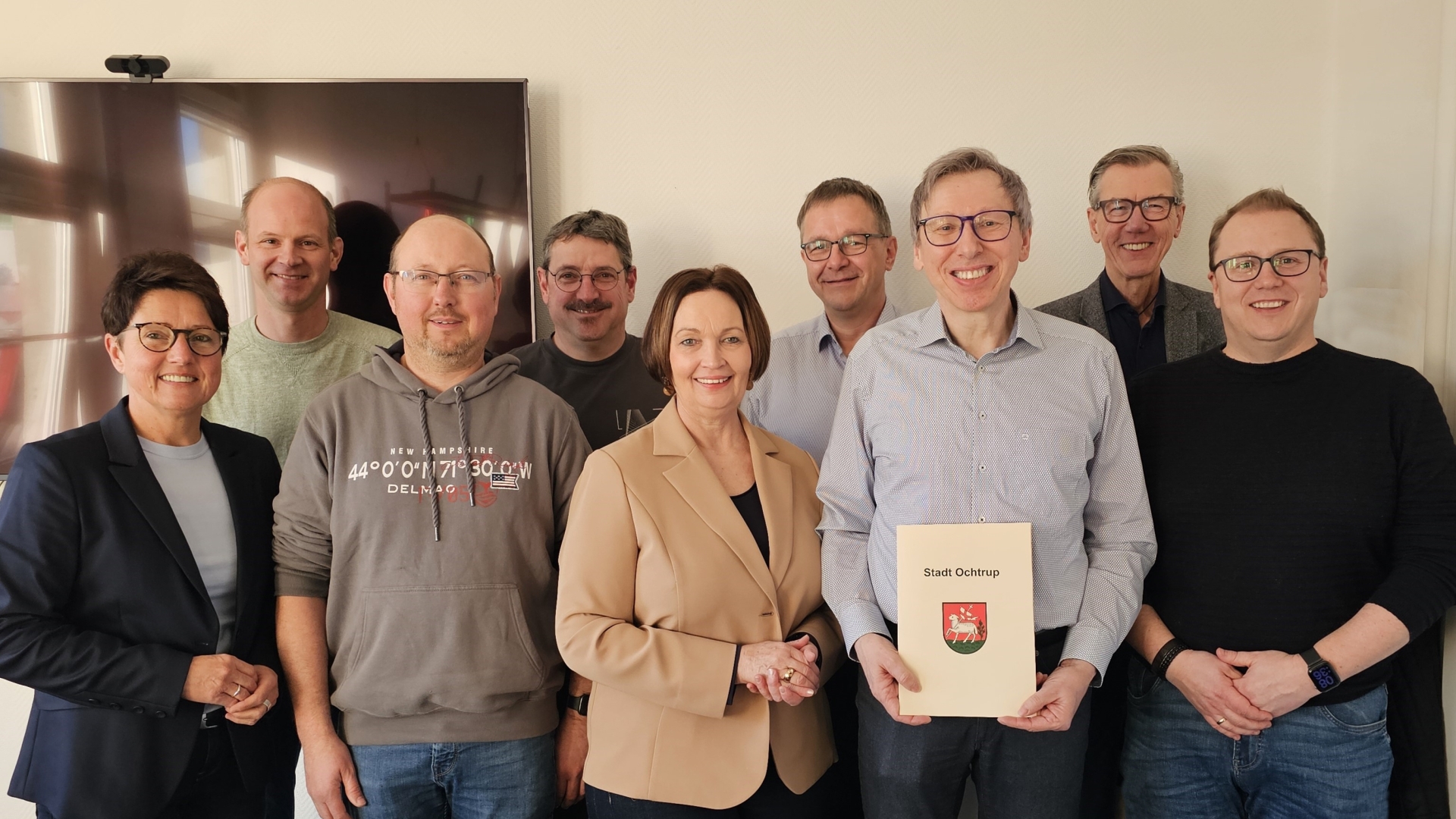 Sie sehen: ein Gruppenbild mit neun Menschen.