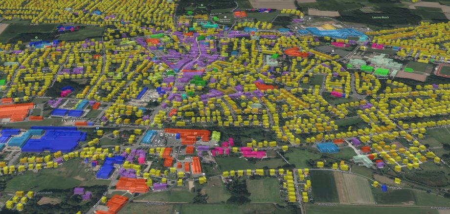 Sie sehen: eine Luftansicht von Ochtrup mit farblich gekennzeichneten Liegenschaften, die die verschiedenen Eignungsbereiche für die kommunale Wärmeplanung darstellen.